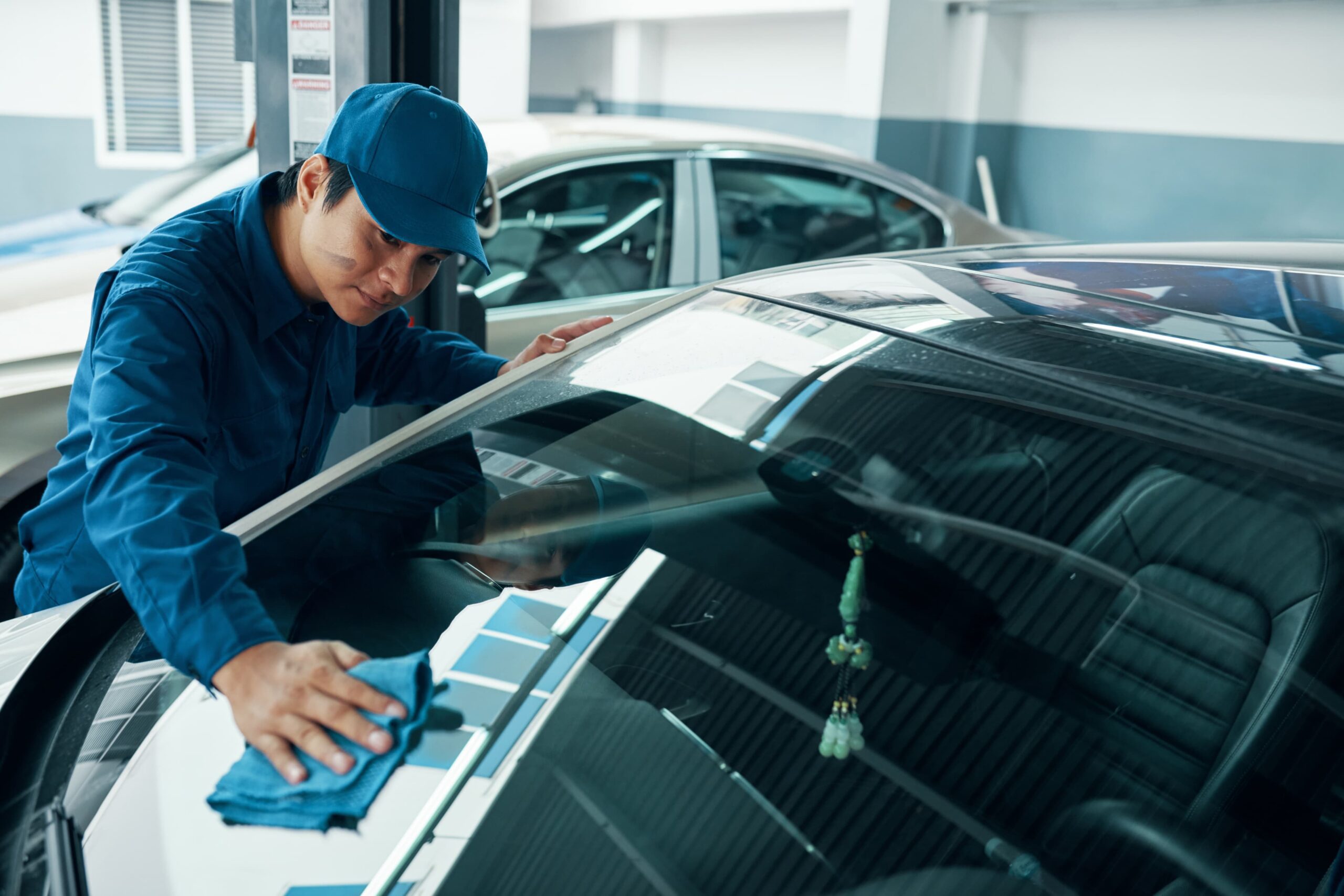 Man Wiping Windshield